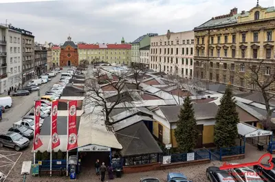 a city with cars parked in a parking lot at Luxury Apartments Nearto Main Square in Kraków