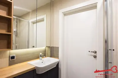 a bathroom with a sink and a mirror at Luxury Apartments Nearto Main Square in Kraków