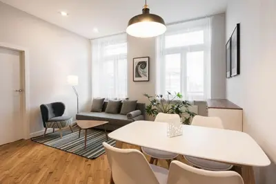 a living room with a white table and chairs at Luxury Apartments Nearto Main Square in Kraków