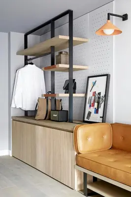 a living room with a couch and a desk at PURO Kraków Kazimierz in Kraków