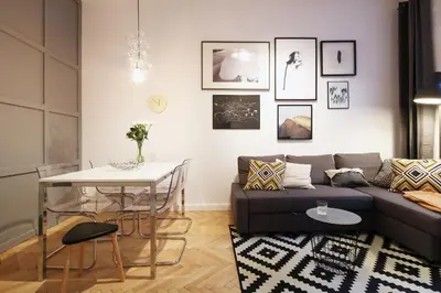 a living room with a couch and a table at BRACKA 15 - Main Square Apartments by MINT APARTMENT in Kraków