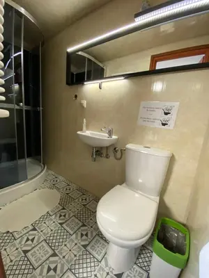 a bathroom with a toilet and a sink at The Boat - Hostel&Chill in Kraków