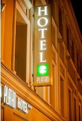 a sign for a hotel on the side of a building at Hotel-Restauracja Platan in Chrzanów