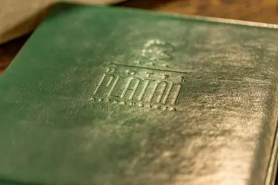 a green book with the word faith on it at Hotel-Restauracja Platan in Chrzanów