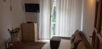 a living room with a couch and a window at Apartament Aga2 in Oświęcim