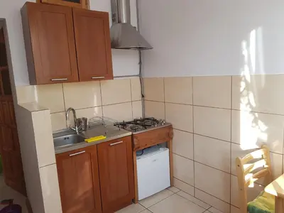 a small kitchen with a sink and a stove at Apartament Aga2 in Oświęcim