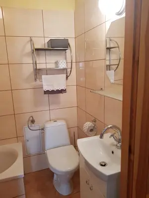 a bathroom with a toilet and a sink at Apartament Aga2 in Oświęcim