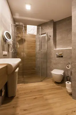 a bathroom with a shower and a toilet and a sink at K4 APARTHOTEL KRAKÓW in Kraków