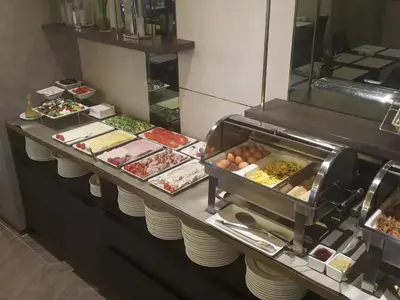 a buffet line with many different types of food at K4 APARTHOTEL KRAKÓW in Kraków