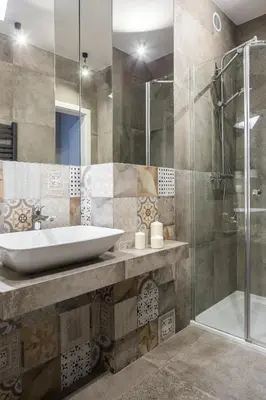 a bathroom with a sink and a shower at Vistula Boutique Exclusive Apartments in Kraków