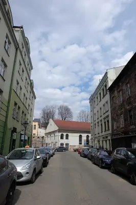 a city street with cars parked on the street at Househost Apartment - Kupa 2 in Kraków