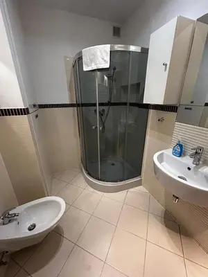 a bathroom with a shower and a sink at SILENT Main Market Square with AC in Kraków