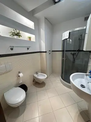 a bathroom with a toilet and a sink and a shower at SILENT Main Market Square with AC in Kraków