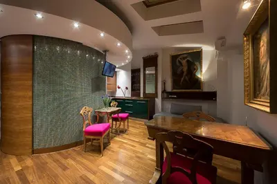 a living room with a table and chairs at Main Square Studio with TERRACE & Air condition in Kraków