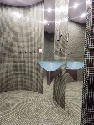 a bathroom with a blue sink and two mirrors at Main Square Studio with TERRACE & Air condition in Kraków