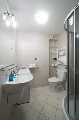 a bathroom with a sink and a toilet and a shower at Main Square Studio with TERRACE & Air condition in Kraków