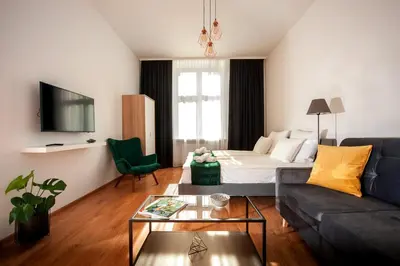 a living room with a bed and a couch at Agnieszki 1 Apartment in Kraków