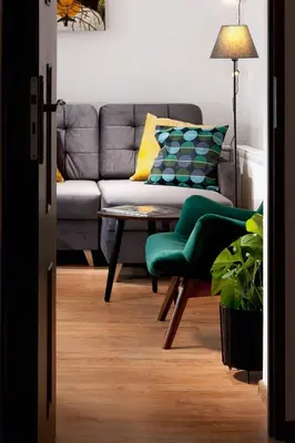 a living room with a couch and a table at Agnieszki 1 Apartment in Kraków