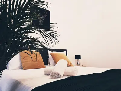 a bedroom with a bed with towels on it at Agnieszki 1 Apartment in Kraków