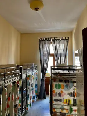 a room with two bunk beds and a window at Ametyst Apartments in Kraków