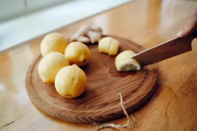 a cutting board with a knife and some food on it at Ostoja in Rzyki