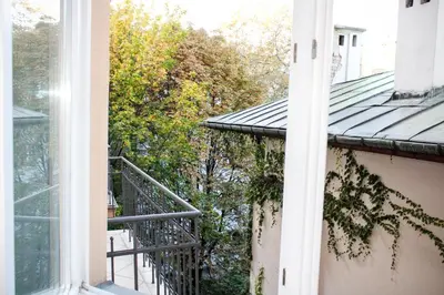 an open window of a house with a balcony at Dominican Square by Hashtag Apartments in Kraków
