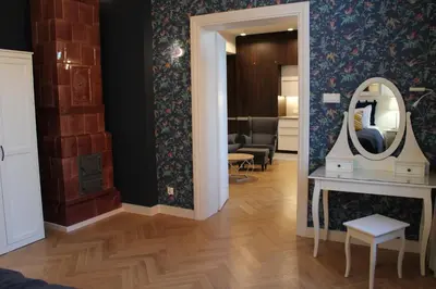 a room with a mirror and a dressing table at Dominican Square by Hashtag Apartments in Kraków