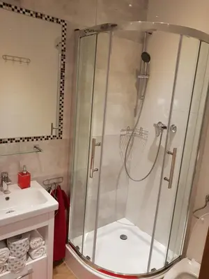 a bathroom with a shower and a sink at Apartamenty Marco 3 przy Dworcu-Stare Miasto-Super Wi Fi in Kraków