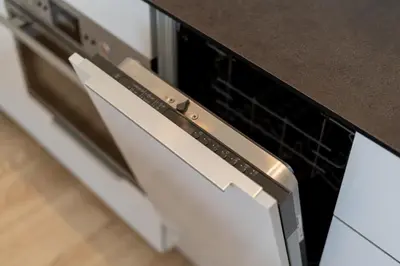 an oven with its door open in a kitchen at Glossy Apart M45 in Kraków