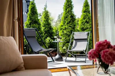 a collage of photos of a living room and dining room at Glossy Apart M54 in Kraków