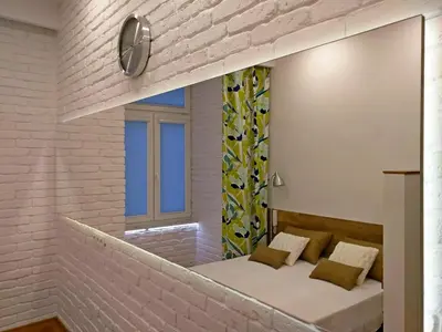 a room with a bed and a mirror at Apartament Starowiślna in Kraków