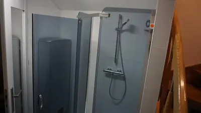 a shower in a bathroom with a glass door at Apartament Starowiślna in Kraków