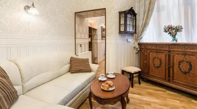 a living room with a couch and a table at Exclusive Royal Apartments in Kraków