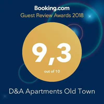 a yellow circle with the number nine and the text quest review awards dsa at D&A Apartments Old Town in Kraków