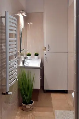 a small kitchen with a sink and a refrigerator at Zator Apartamenty Weekend in Zator