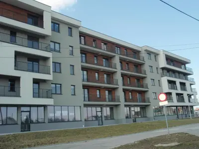 an apartment building on the side of a street at Zator Apartamenty Weekend in Zator