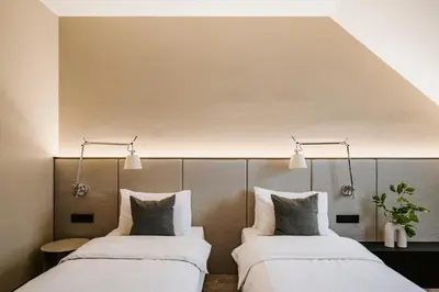 a bedroom with a large bed with at Poziom 511 Jura Wellness Hotel & Spa in Ogrodzieniec