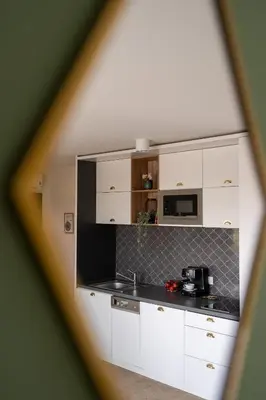 a living room with a couch and a table at 3 Minutes Apartments Old Town in Kraków