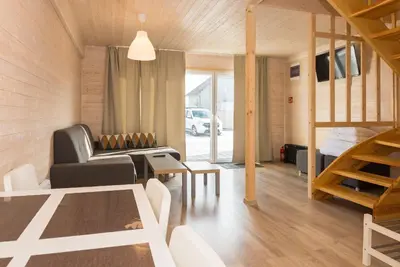a living room with a couch and a table at Old Tree Village & Restaurant in Oświęcim