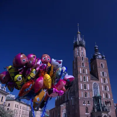 a bunch of balloons in front of a building at Anno Domini Apartment by Cozyplace in Kraków