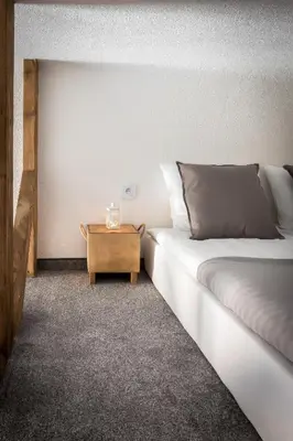 a bedroom with a bed and a wooden table at Cracow Best Location Apartment by Cozyplace in Kraków