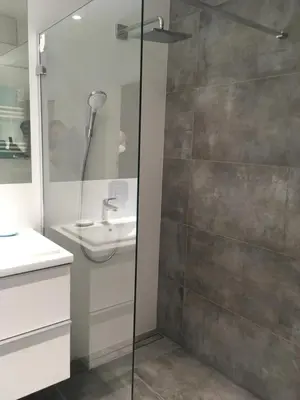 a bathroom with a shower and a sink at Apartment in the Gantry Hall - W19 in Kraków