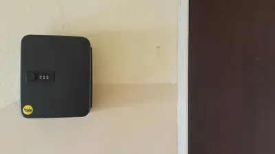 a black electrical box on the side of a wall at Apartament Kolorowy in Kraków