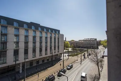 a view of a city street with a building at Fogra Travel Apartment in Kraków
