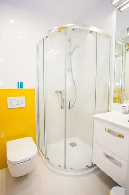 a bathroom with a shower with a toilet and a sink at Apartamenty SaltApart2 in Wieliczka