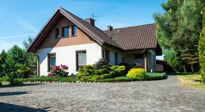 a house with a driveway in front of it at Charming place - Kraków Gdów Jacuzzi in Gdów