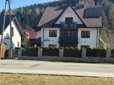 a bedroom with a wall mural of a city at Noclegi u Marii - Koninki in Poręba Wielka