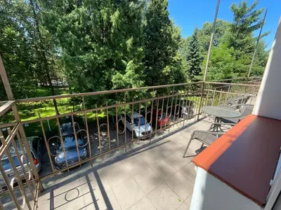 a bedroom with two beds and two windows at Parkowa Rezydencja Hubal in Rabka