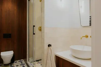 a bathroom with a sink and a toilet at Apartments Floriańska 24 by MB Apartments in Kraków