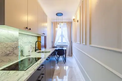 a kitchen with a counter and a sink in it at MR 3 Apartments in Kraków